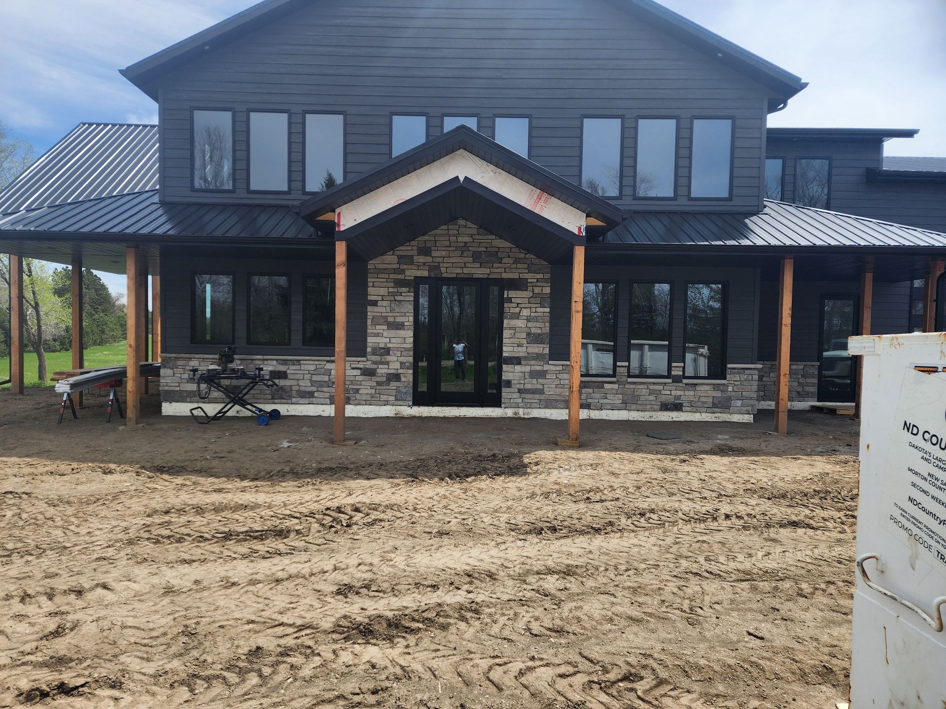 a large house with a lot of windows is being built