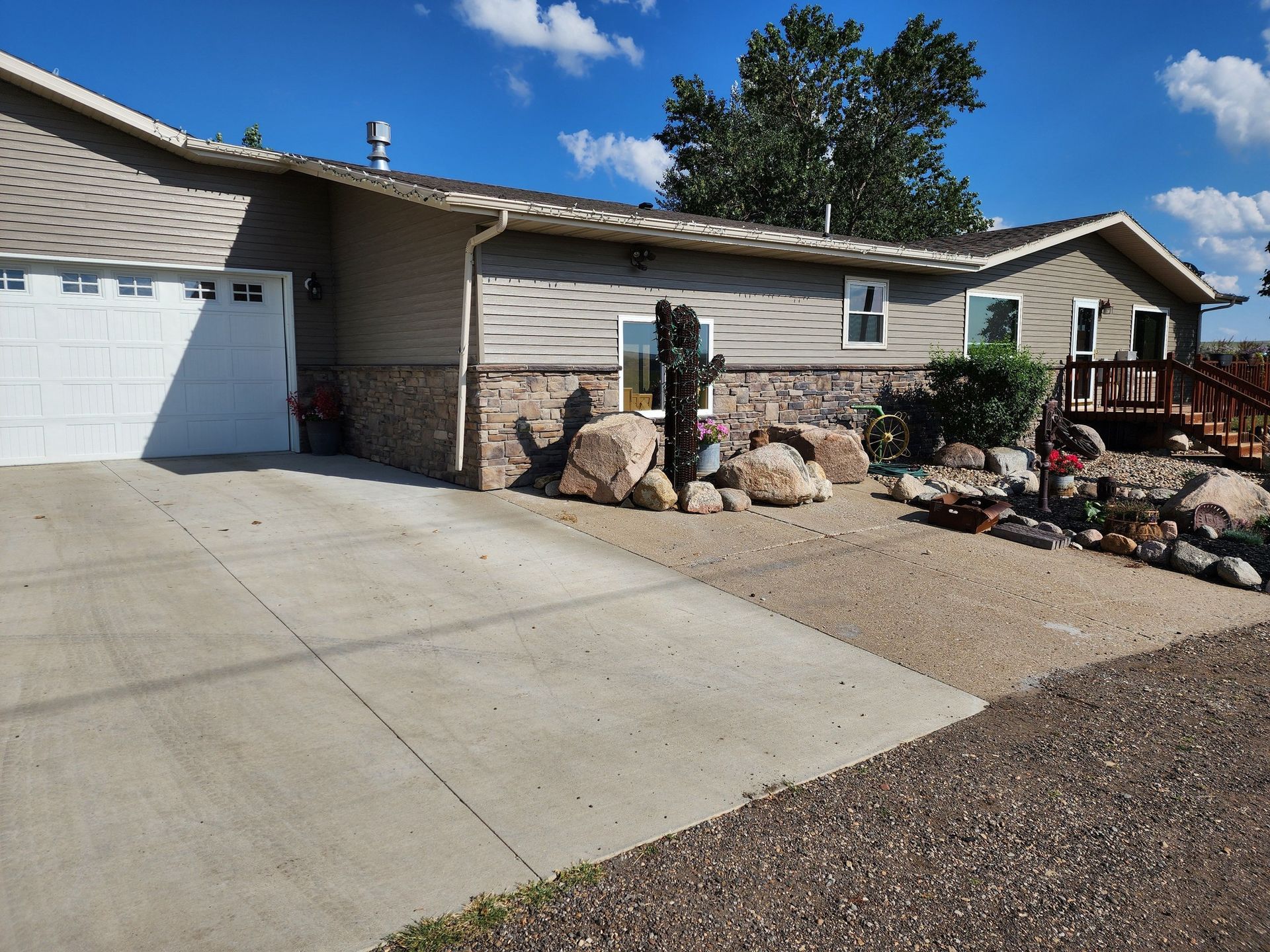 a house with a garage and a driveway in front of it