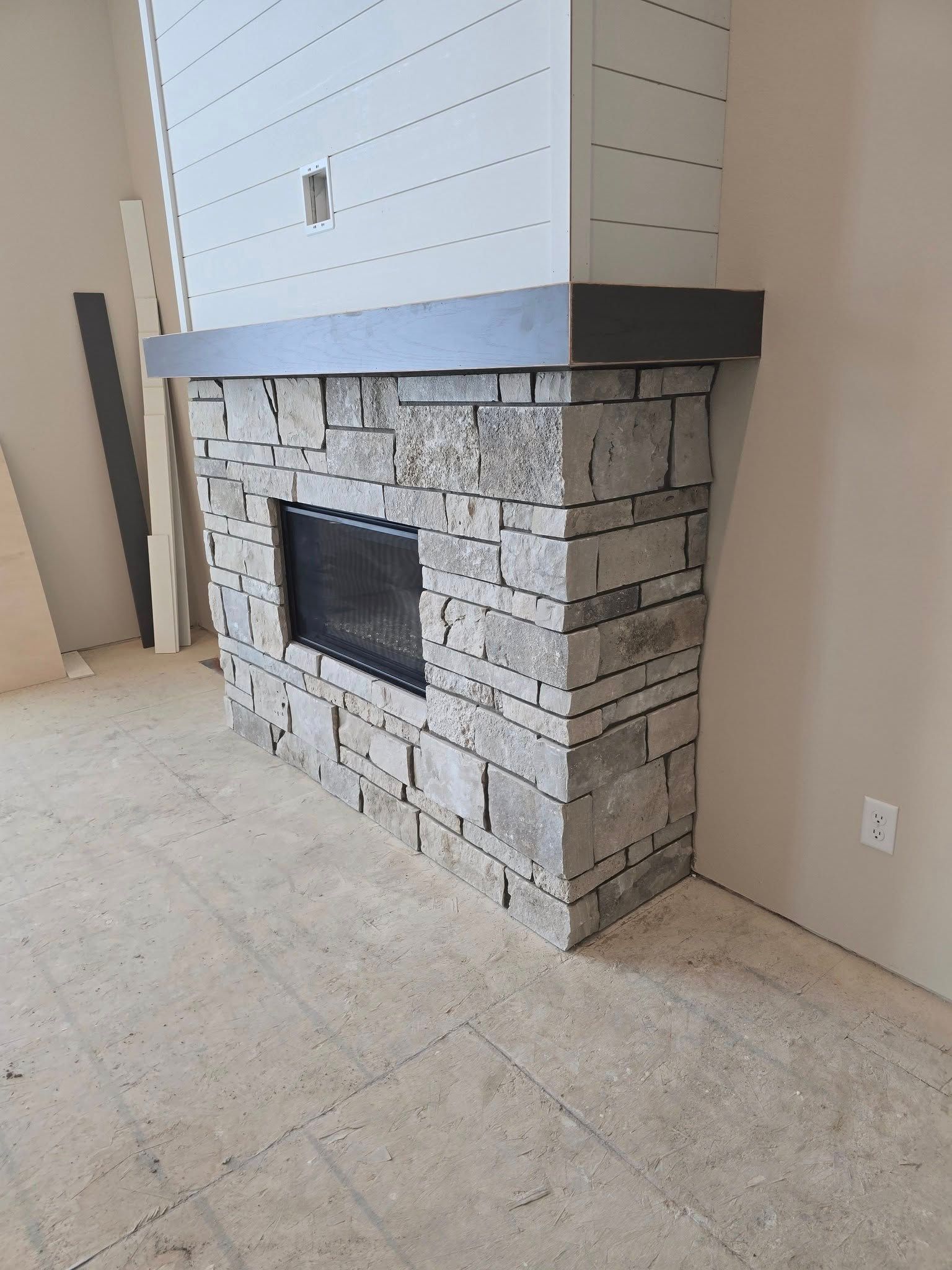 a fireplace in the corner of the room