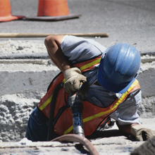 Worker removing concrete