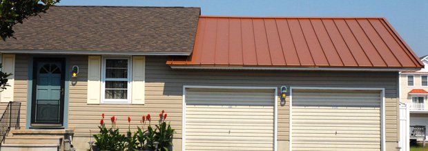House with both metal roof and shingles