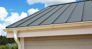 Metal roofing with clean gutters
