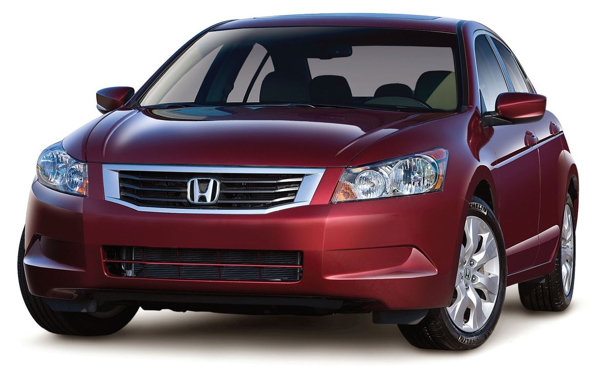 Red Honda Accord car, front view, parked on a white background.