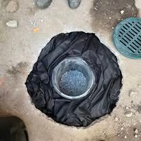 A manhole cover is covering a hole in the ground.