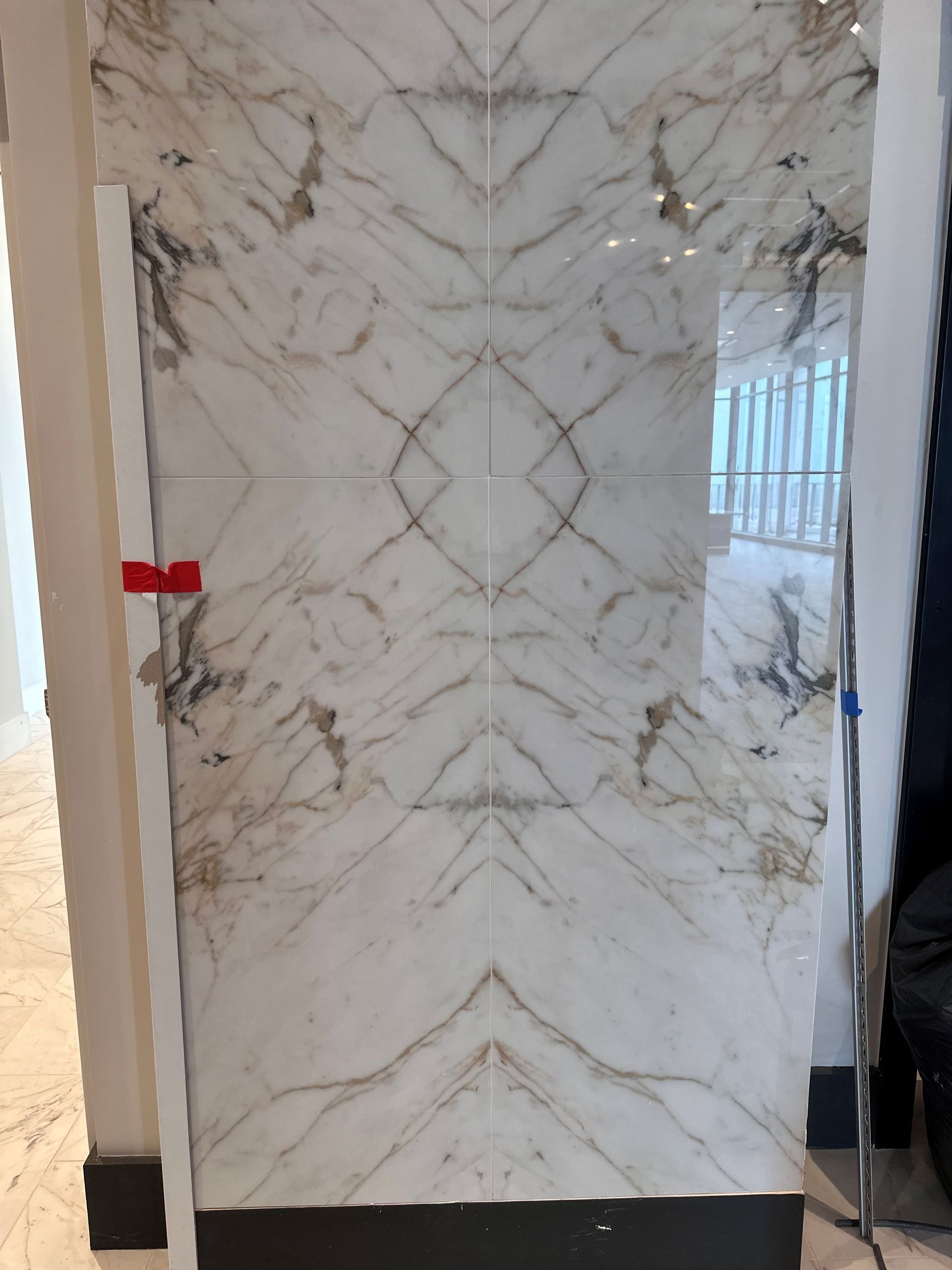 A marble wall with a geometric pattern on it