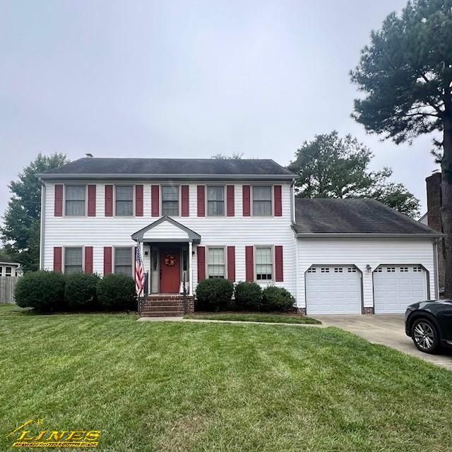 White two-story house with red shutters, green lawn, and a two-car garage on an overcast day.