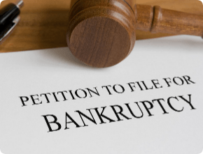 Bankruptcy petition notice with judge's wooden gavel