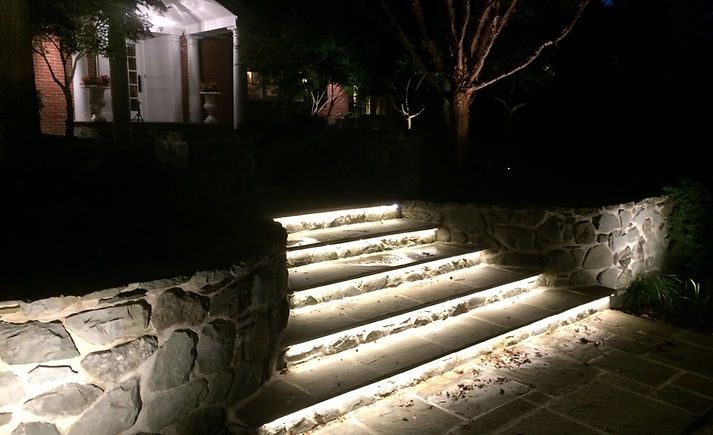 a set of stairs that are lit up at night