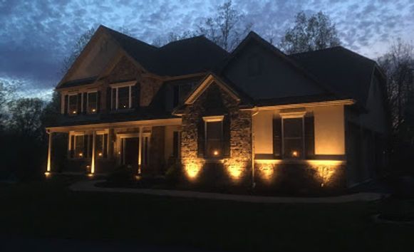 a large house is lit up at night