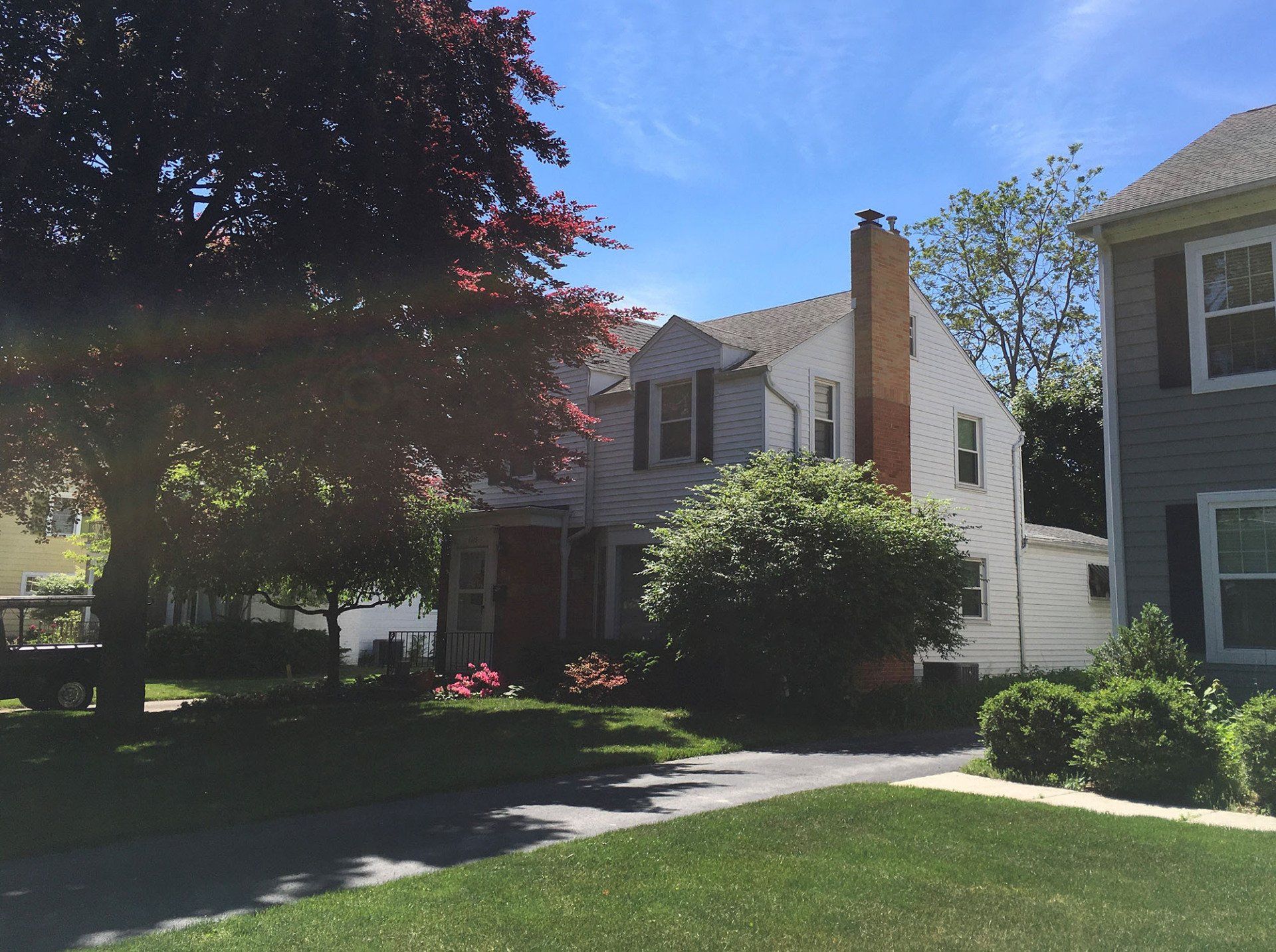 Two-story white house with a chimney