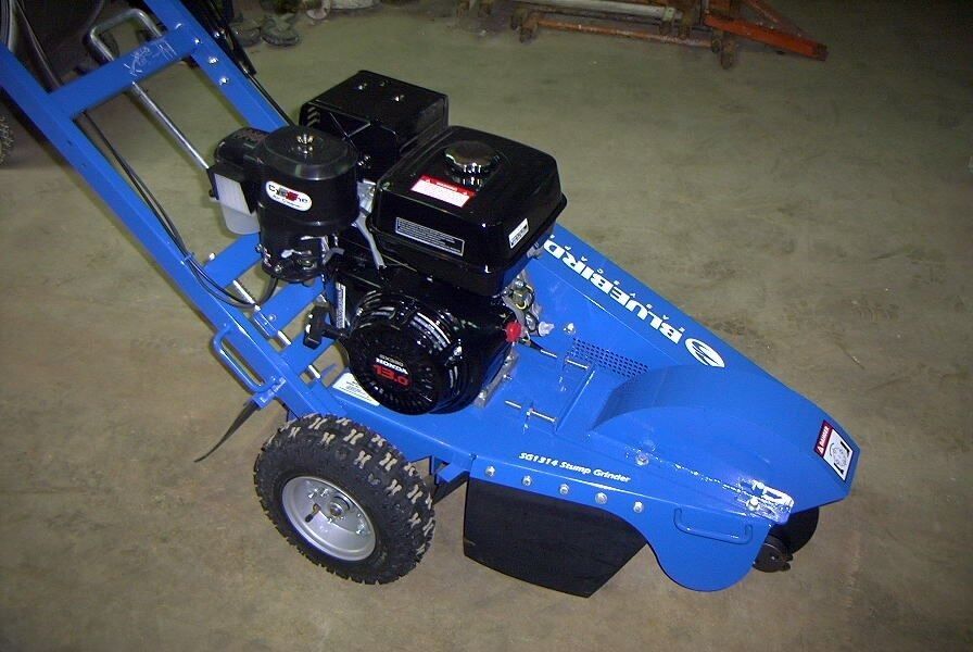 Blue stump grinder with two black engines and a tire.