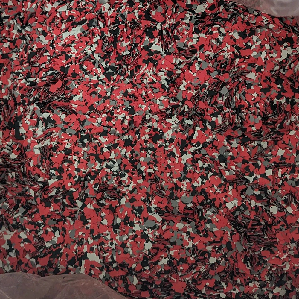 Red, black, gray, and white decorative floor coating.