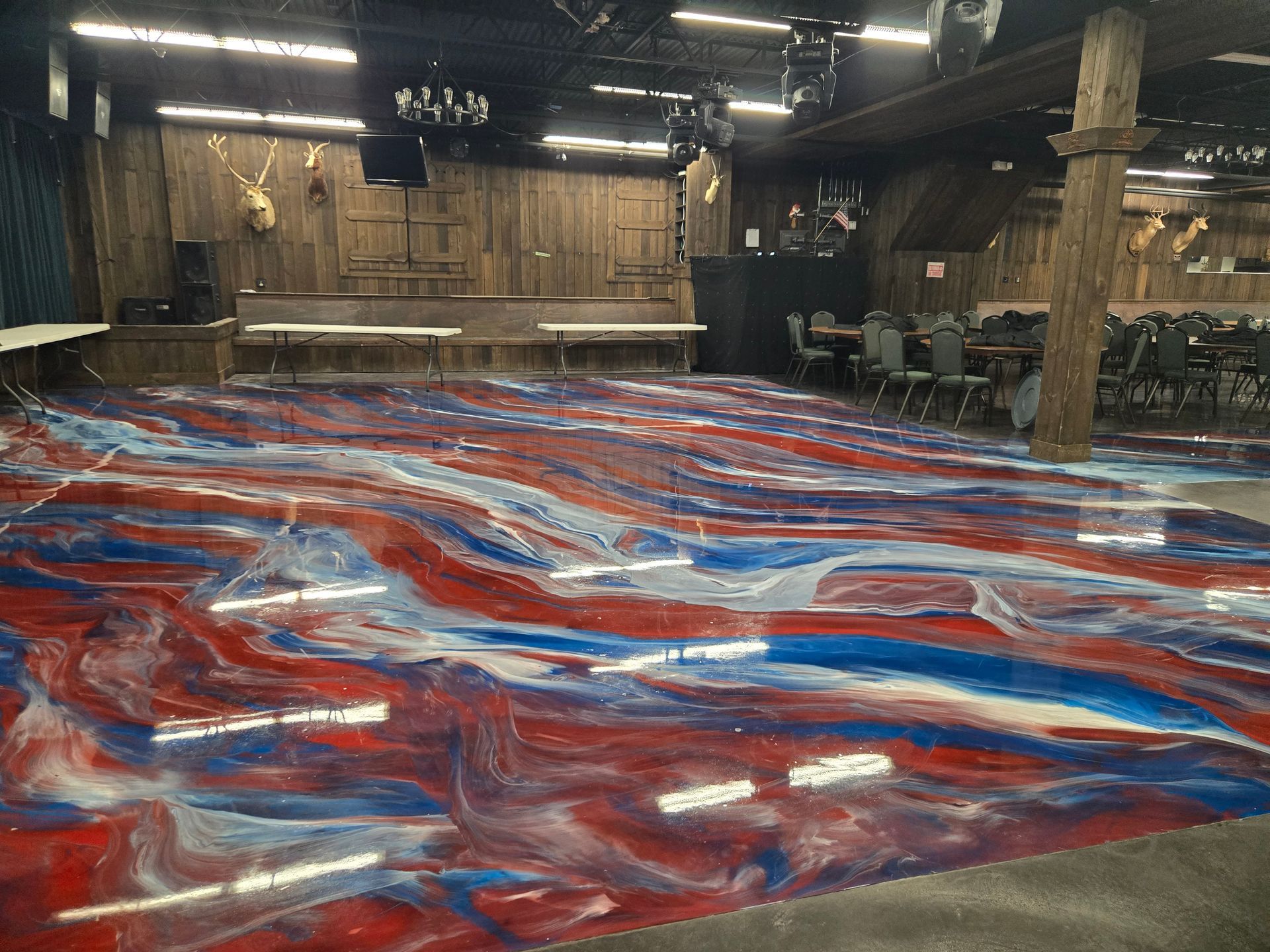 A large room with a red, white, and blue swirled floor