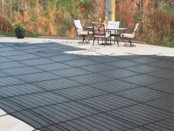 A patio with a table and chairs on it