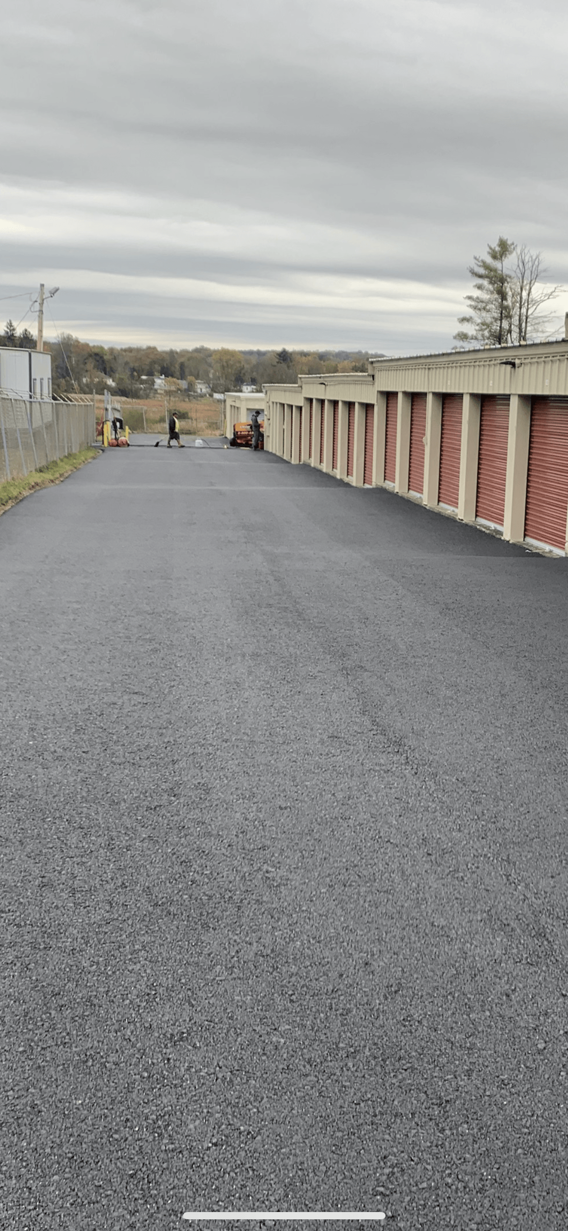 A row of garages along the side of a road