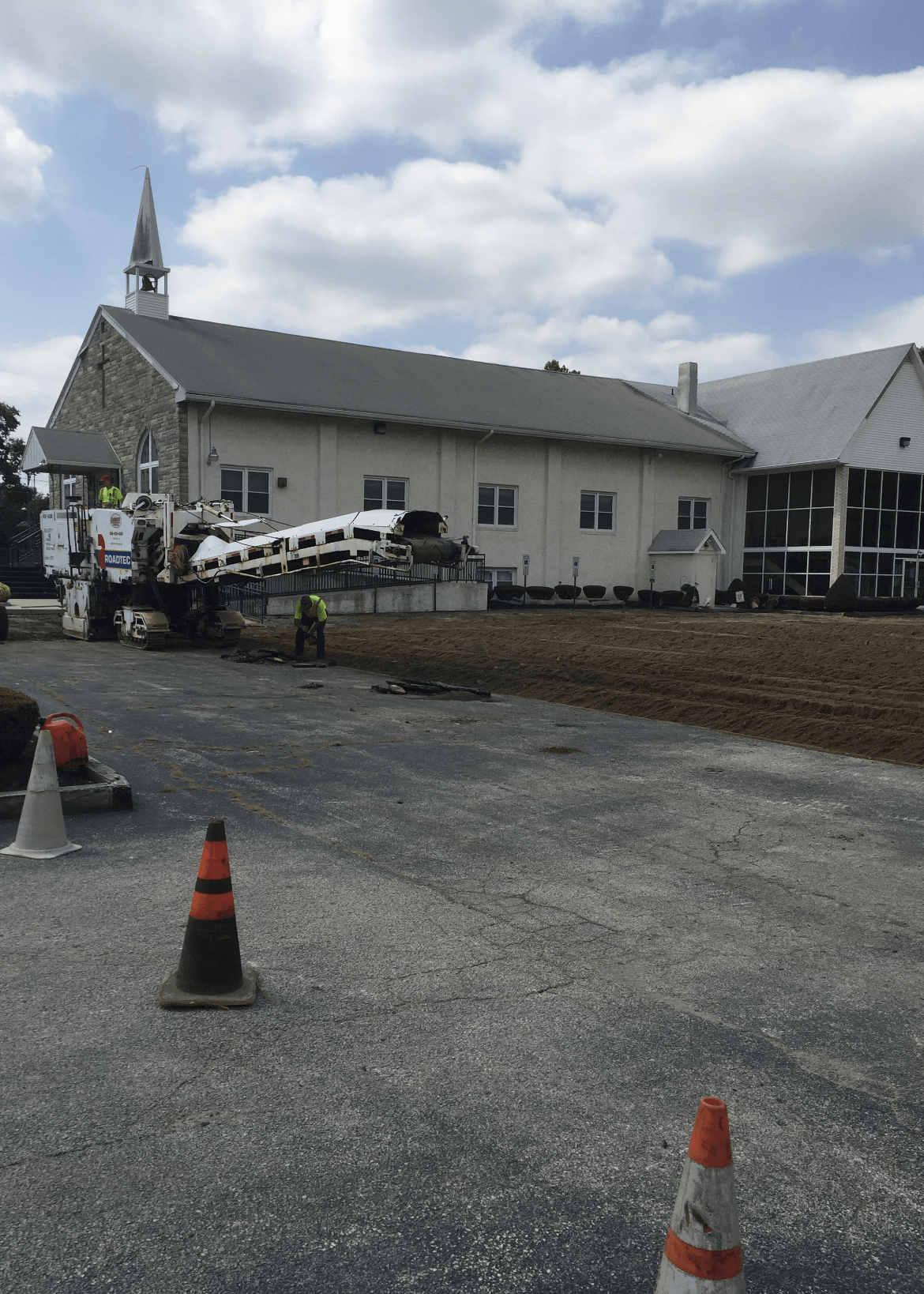 Road repair with a church in the background