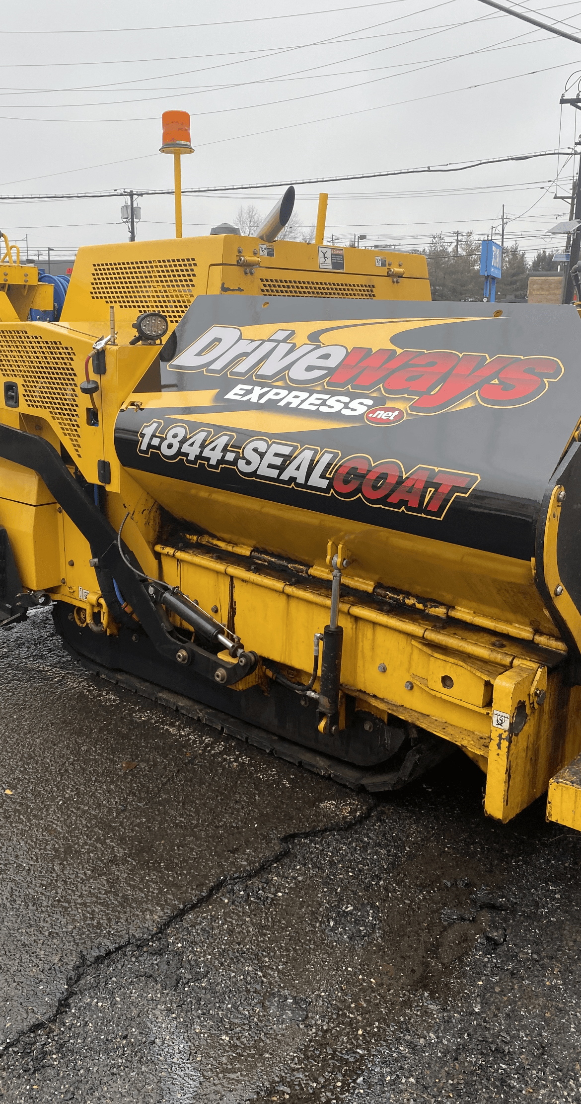 Driveways Express yellow truck