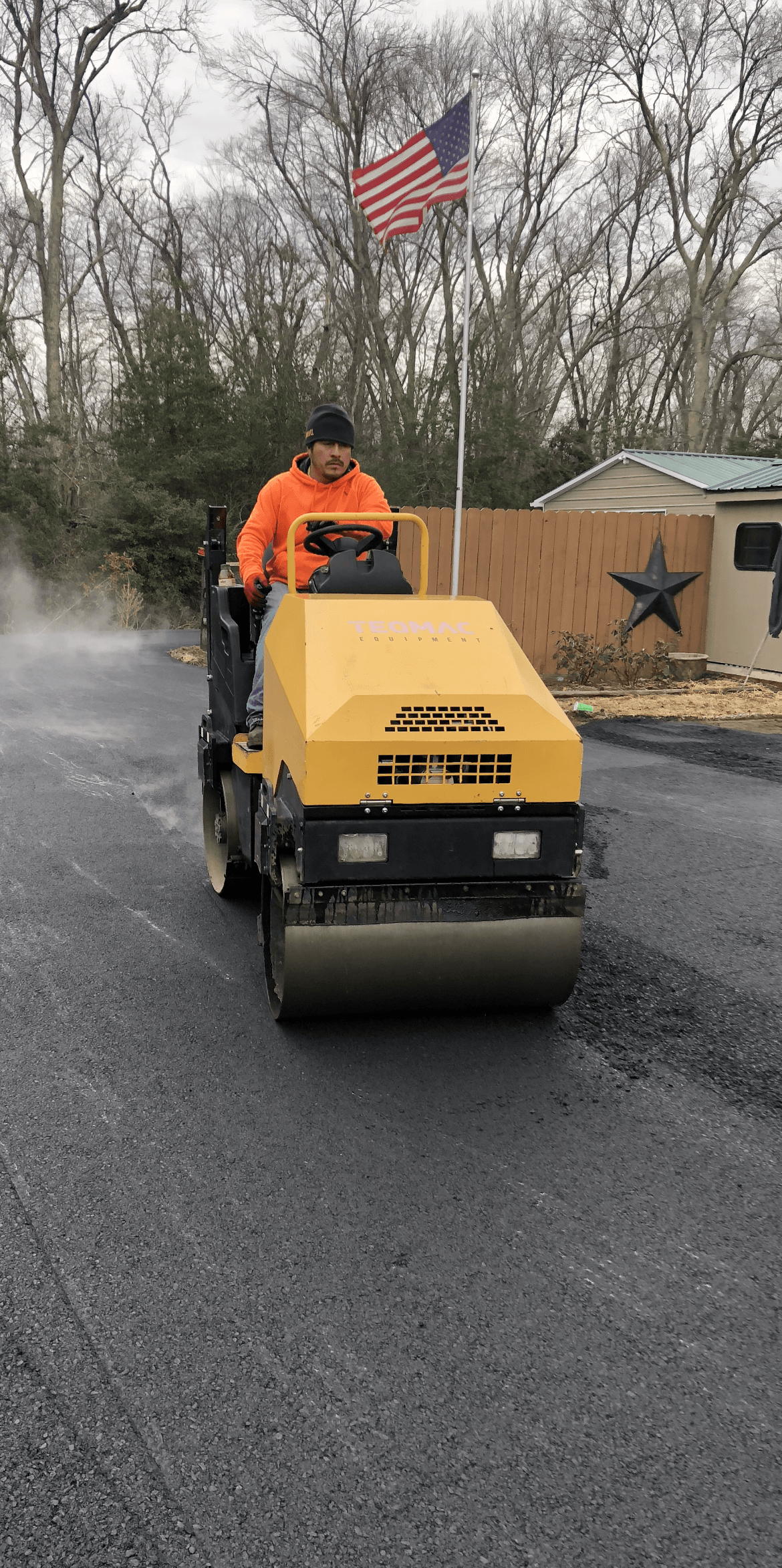 Man riding an asphalt roller