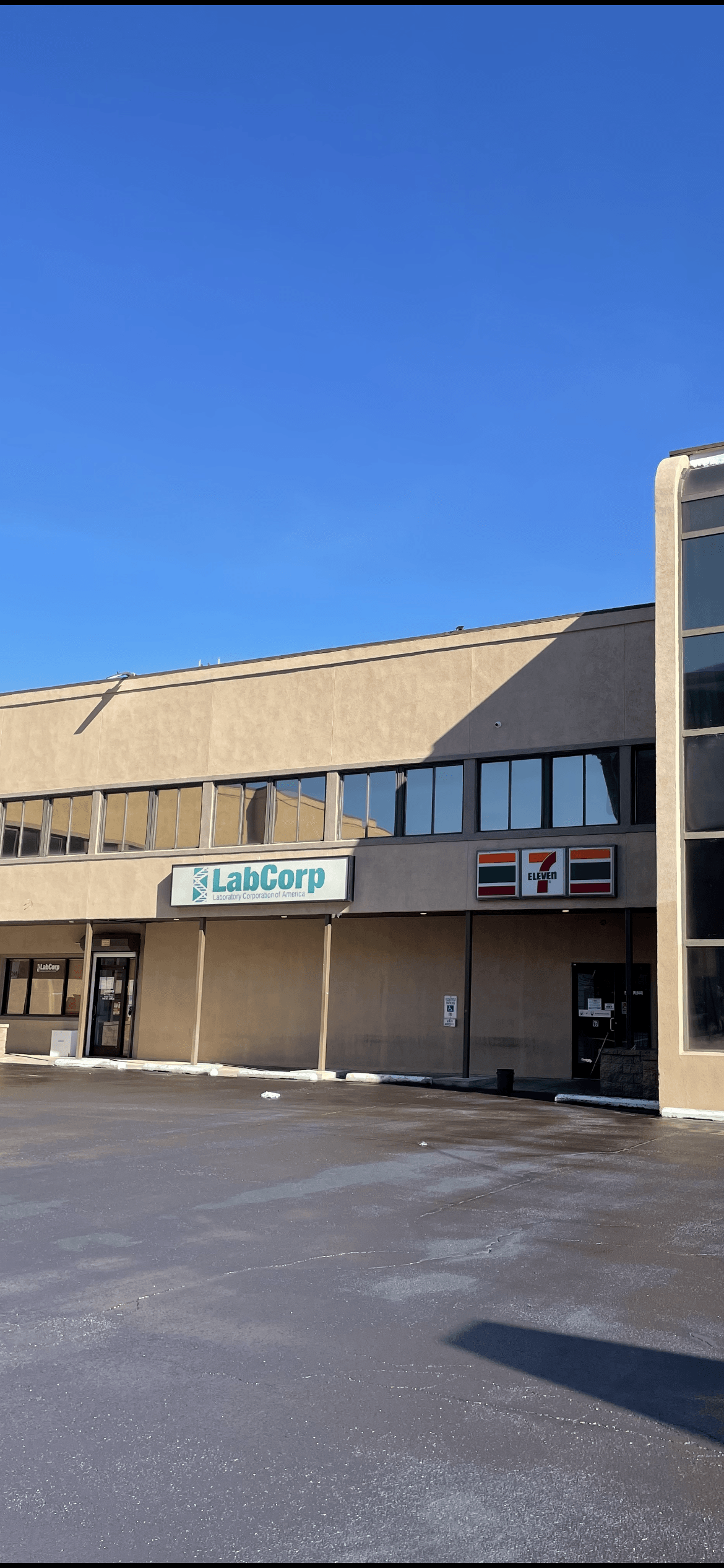 A large building with a blue sky in the background