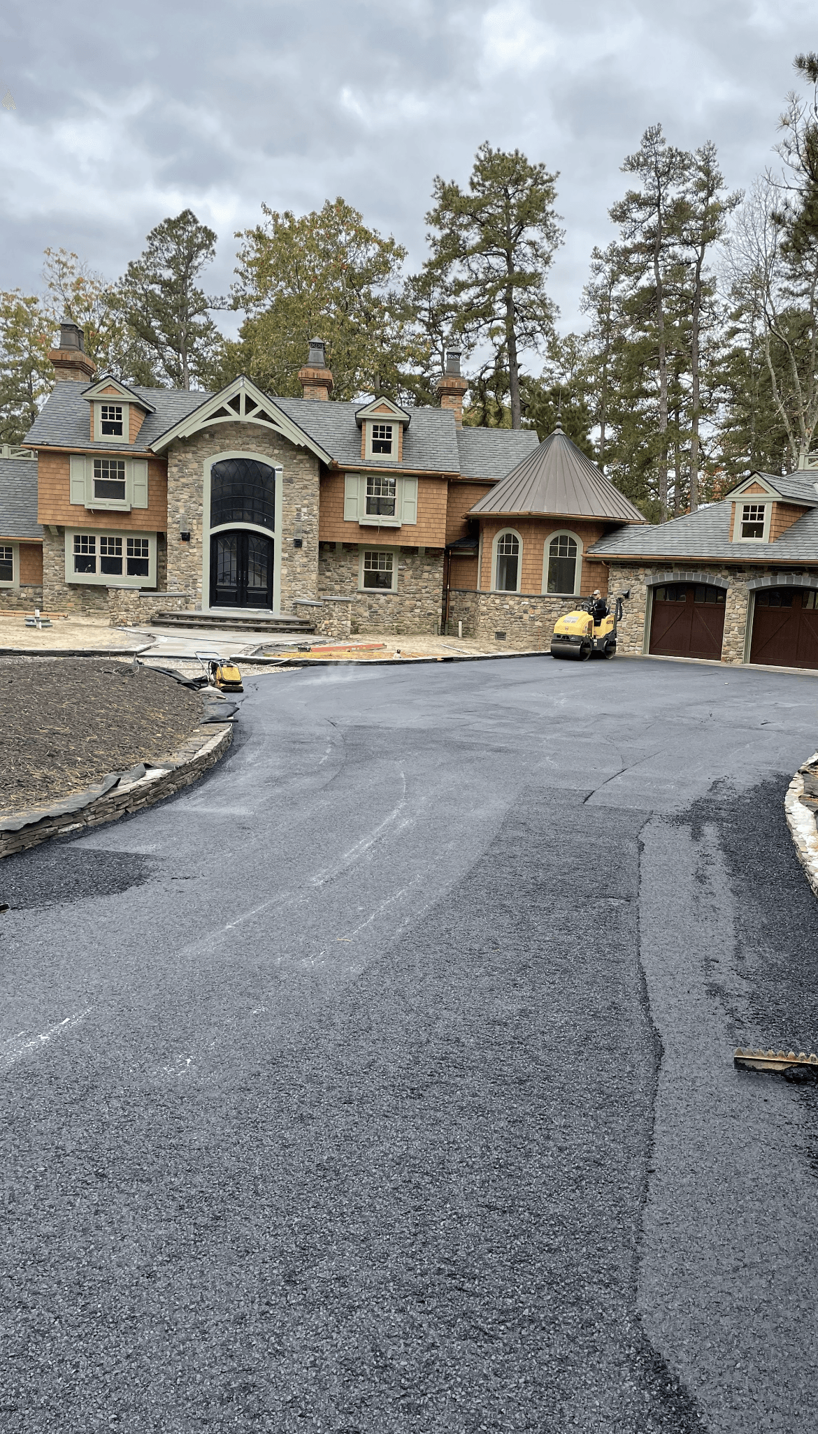 A large house with asphalt driveway