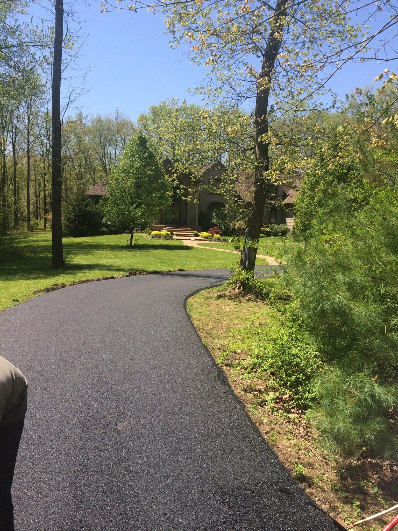 Curved driveway in front of a house