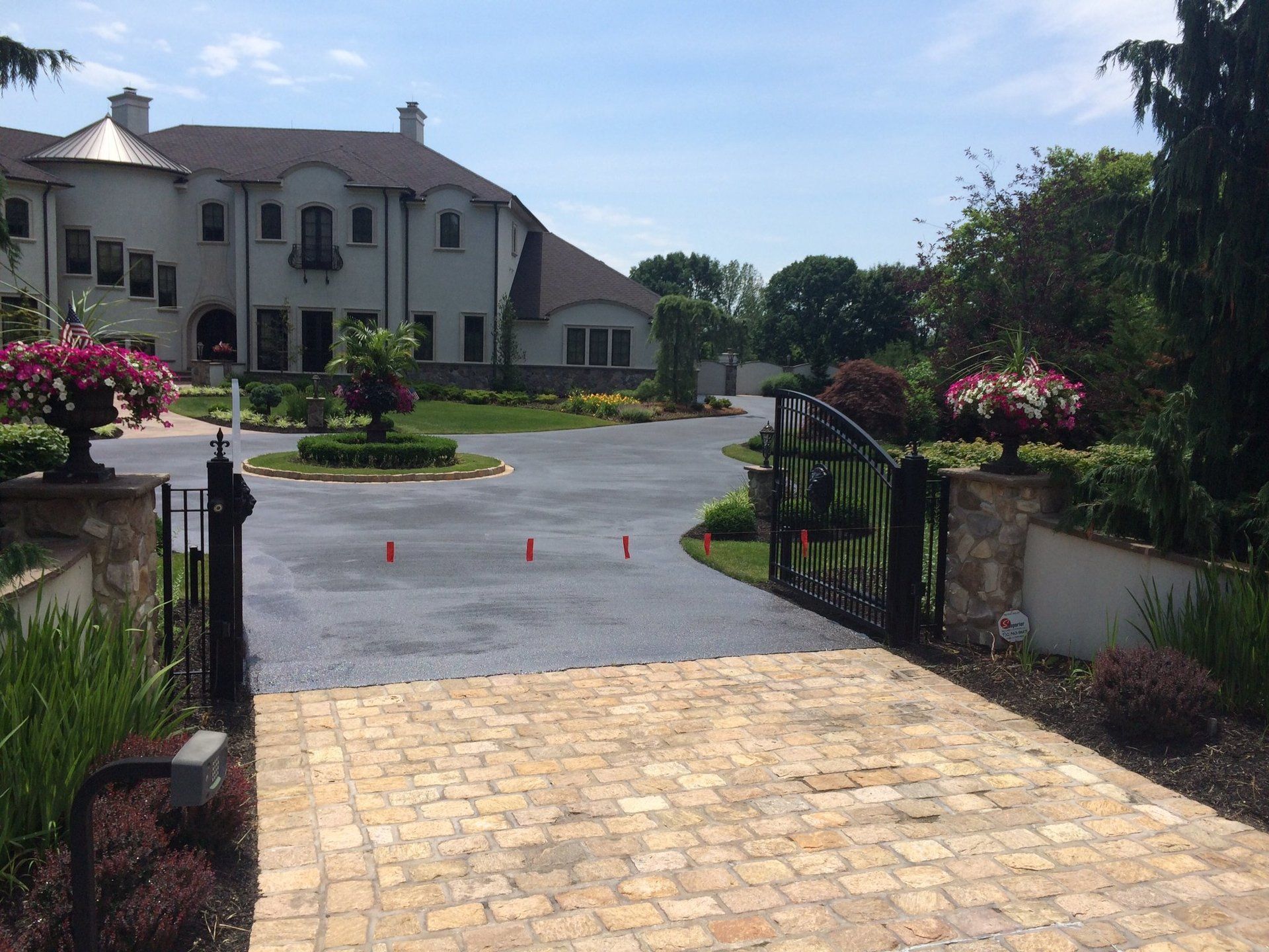 A large house with a driveway leading to it