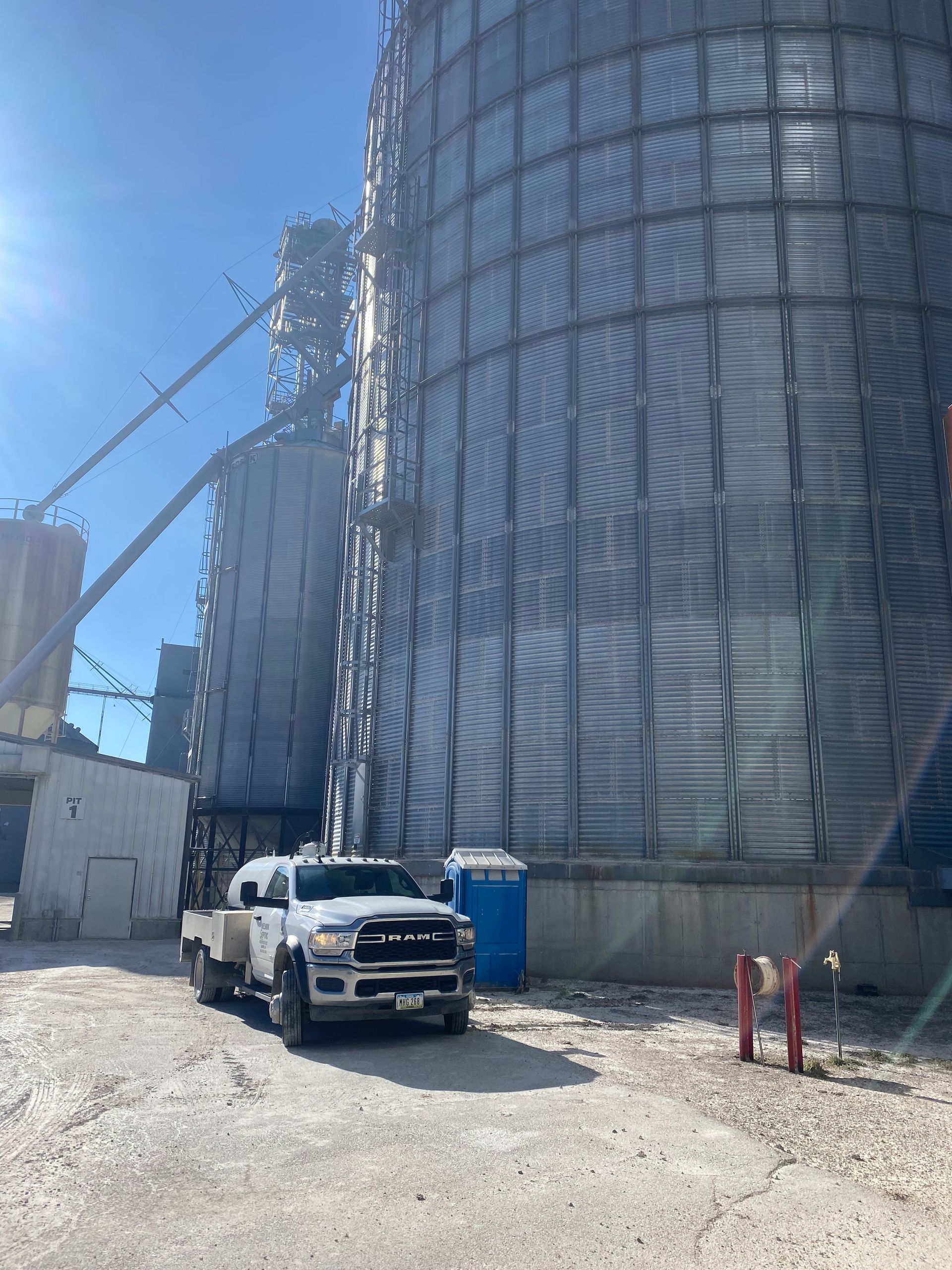 A truck is parked in front of a large building