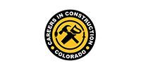 Circular yellow and black logo with a hammer and saw, reading 