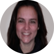 Woman with long dark hair smiles. In a circular frame.