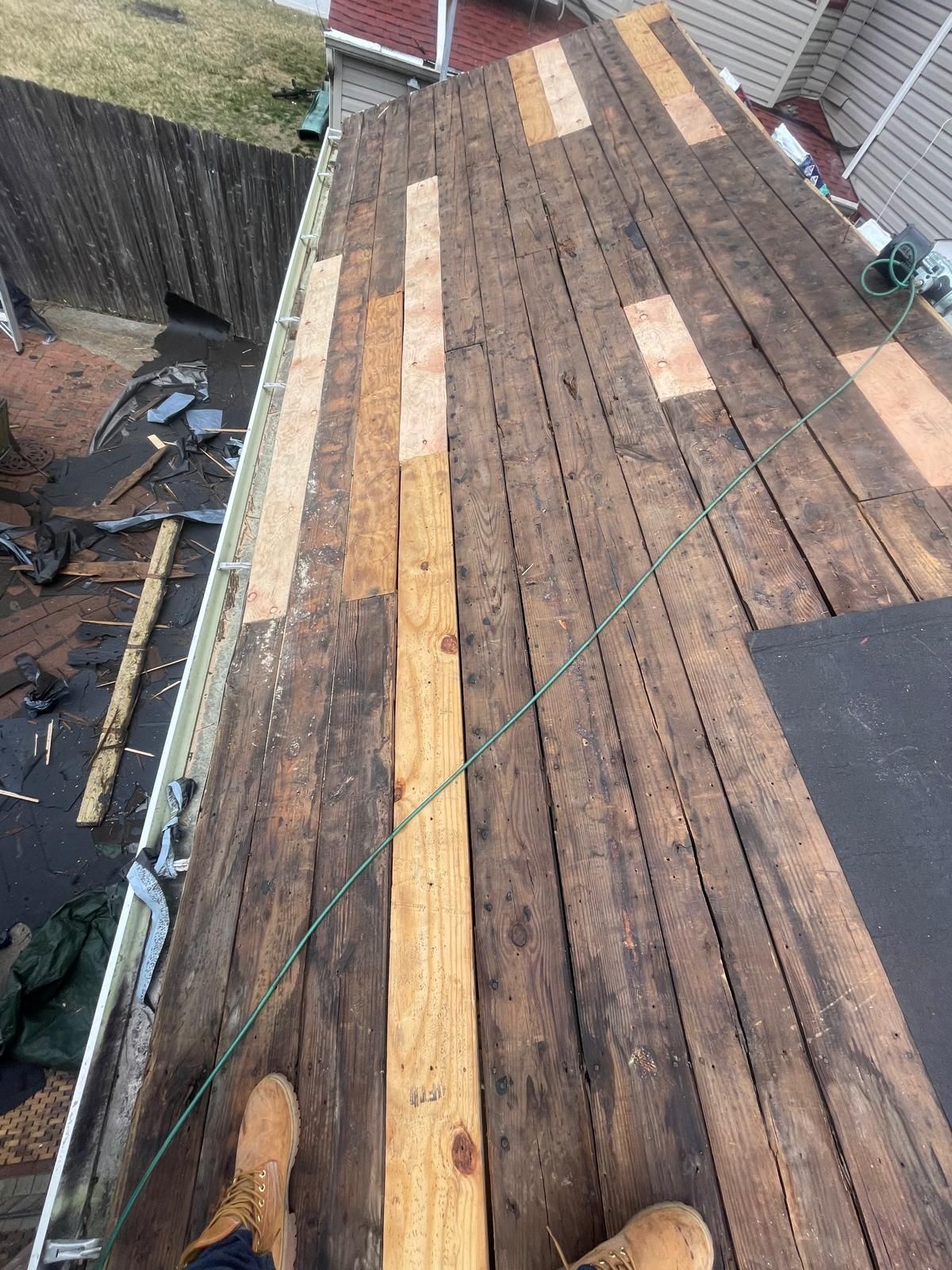 A roof with a chimney on top of it in a residential area.