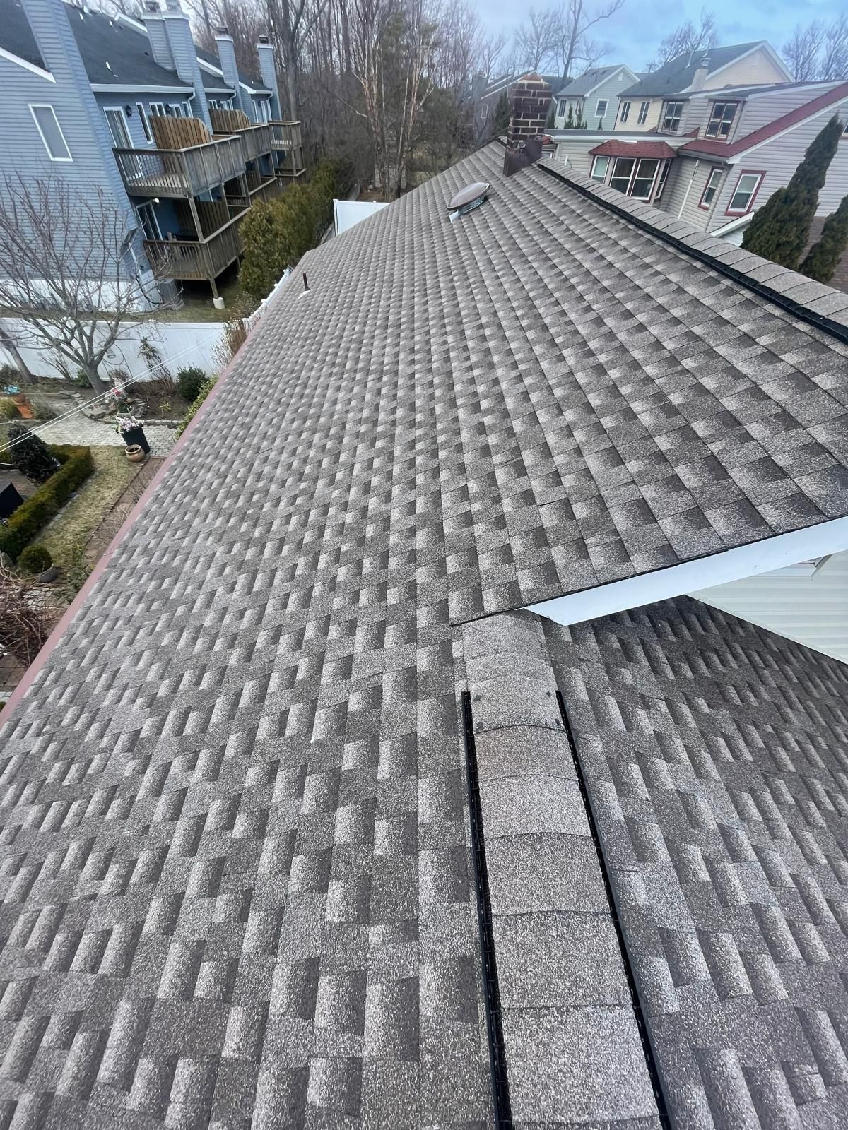 A close up of a roof with a lot of shingles on it.