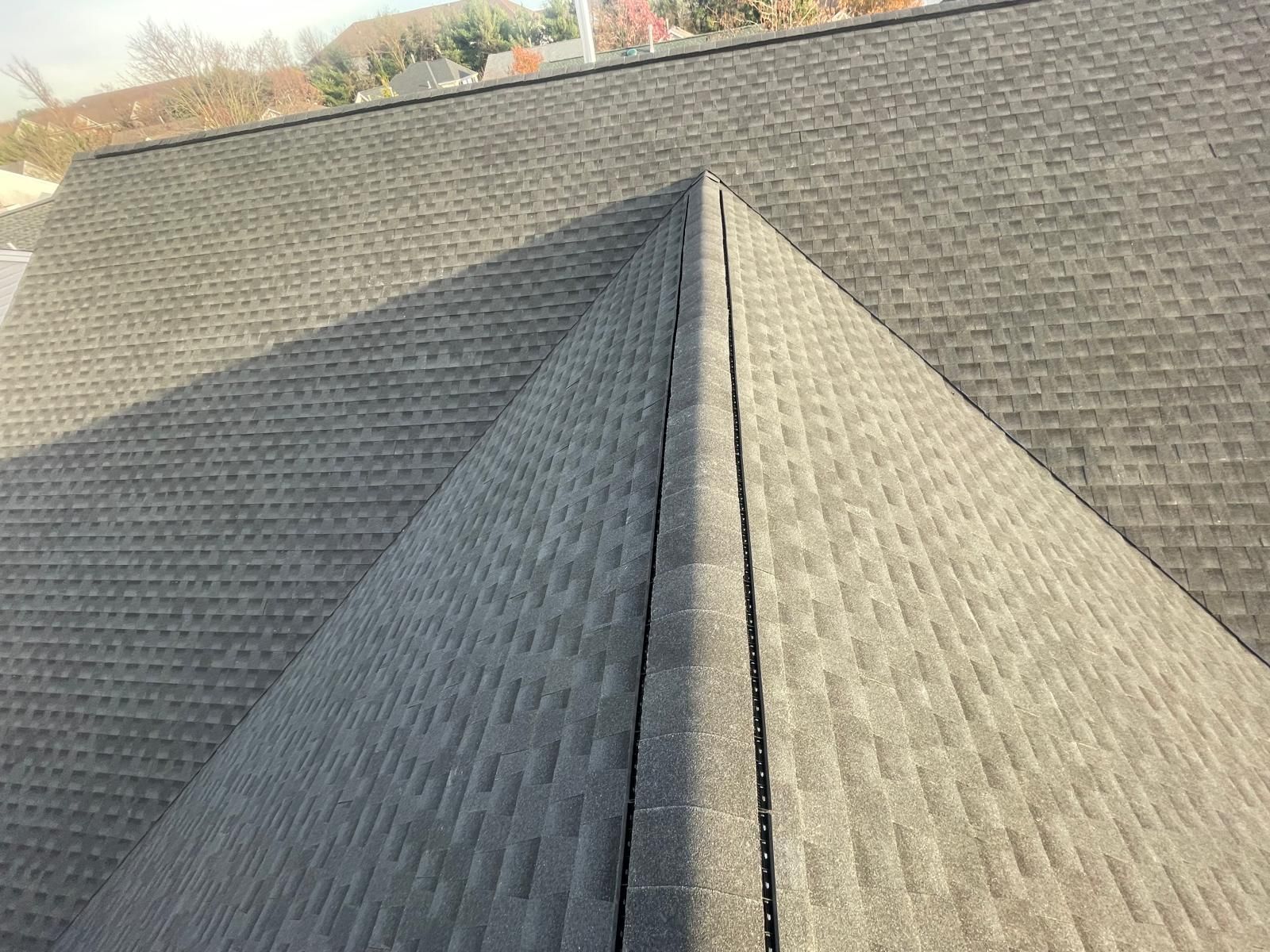 A close up of a roof with shingles on it.