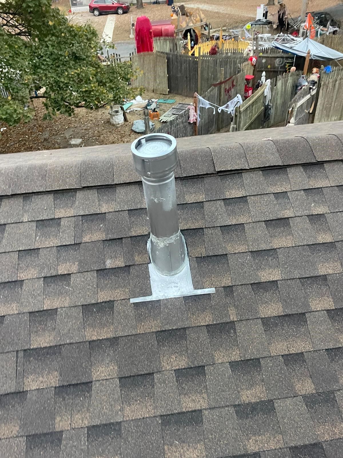 A chimney is sitting on top of a roof.