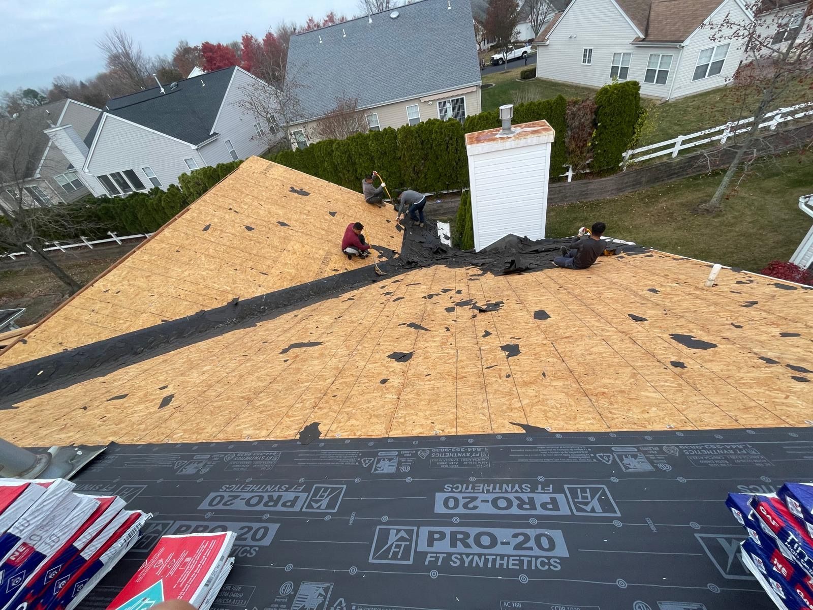 An aerial view of a roof that is being repaired