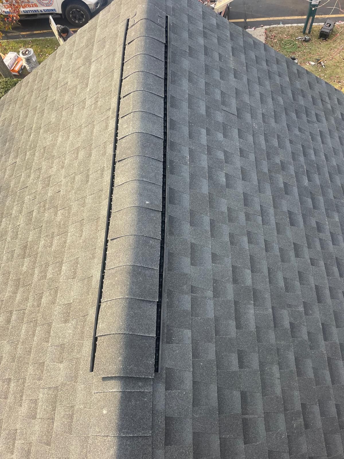 A close up of a roof with shingles on it.