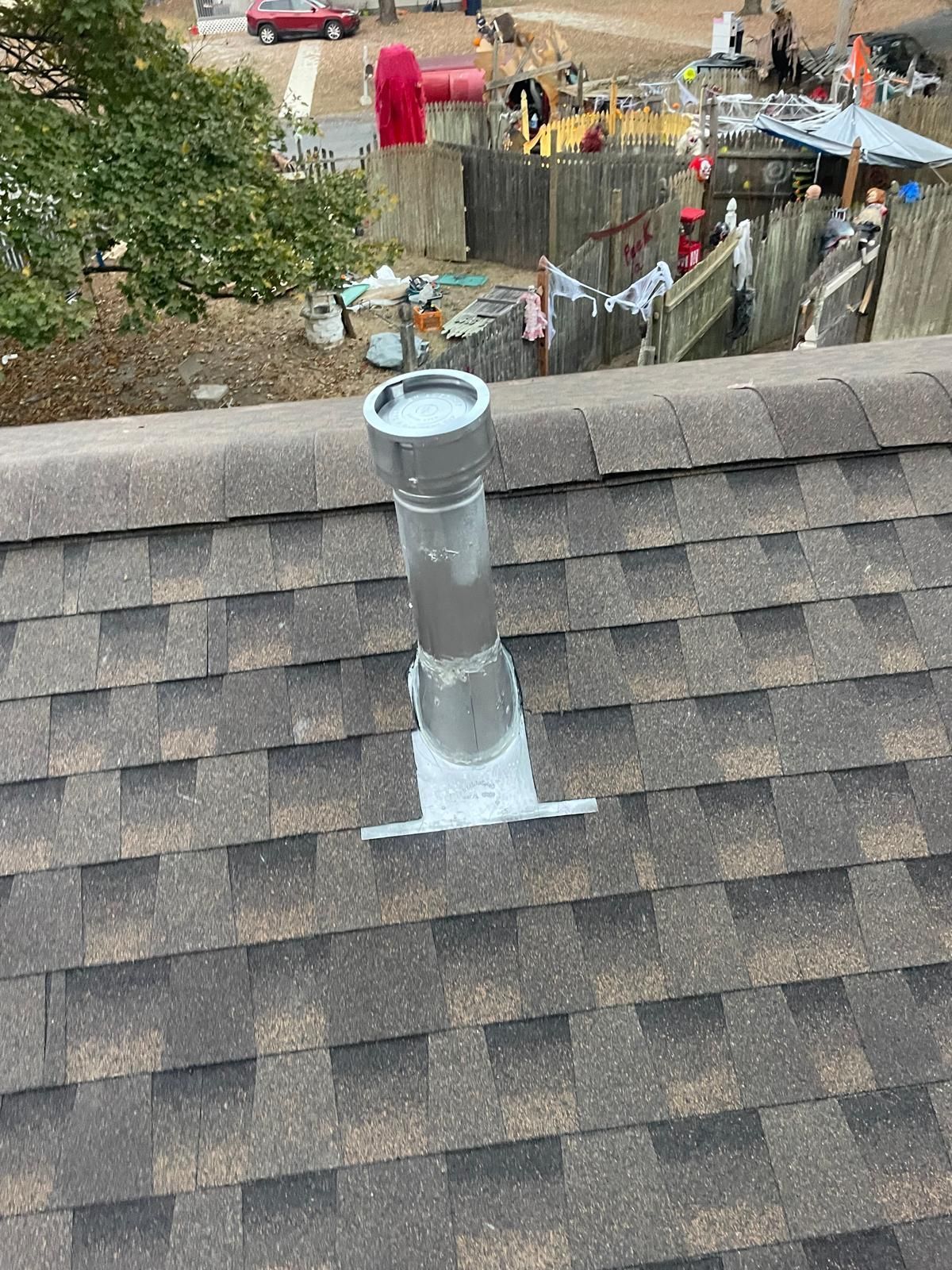A chimney is sitting on top of a roof.