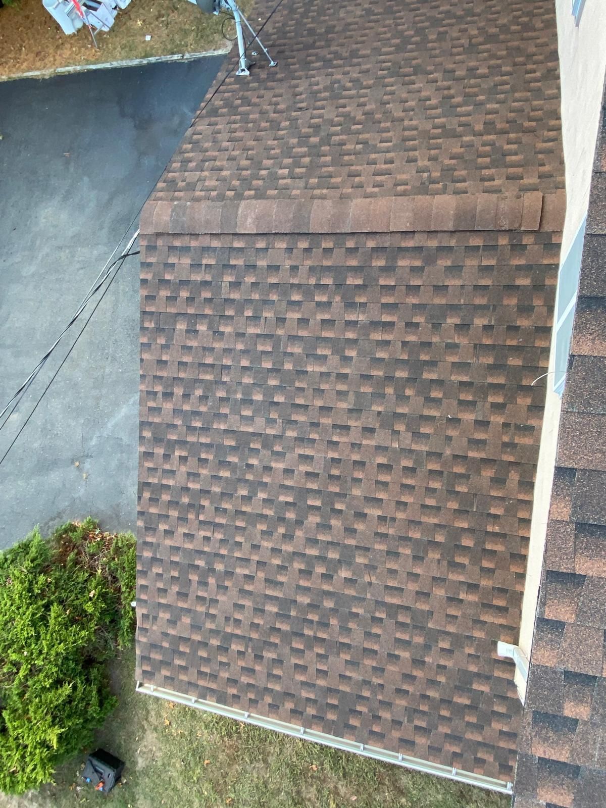 An aerial view of a house with a brown roof.