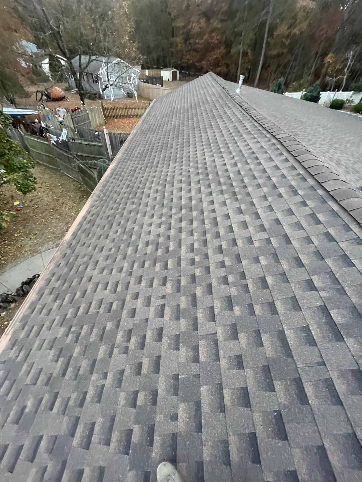 A close up of a roof with a lot of shingles on it.