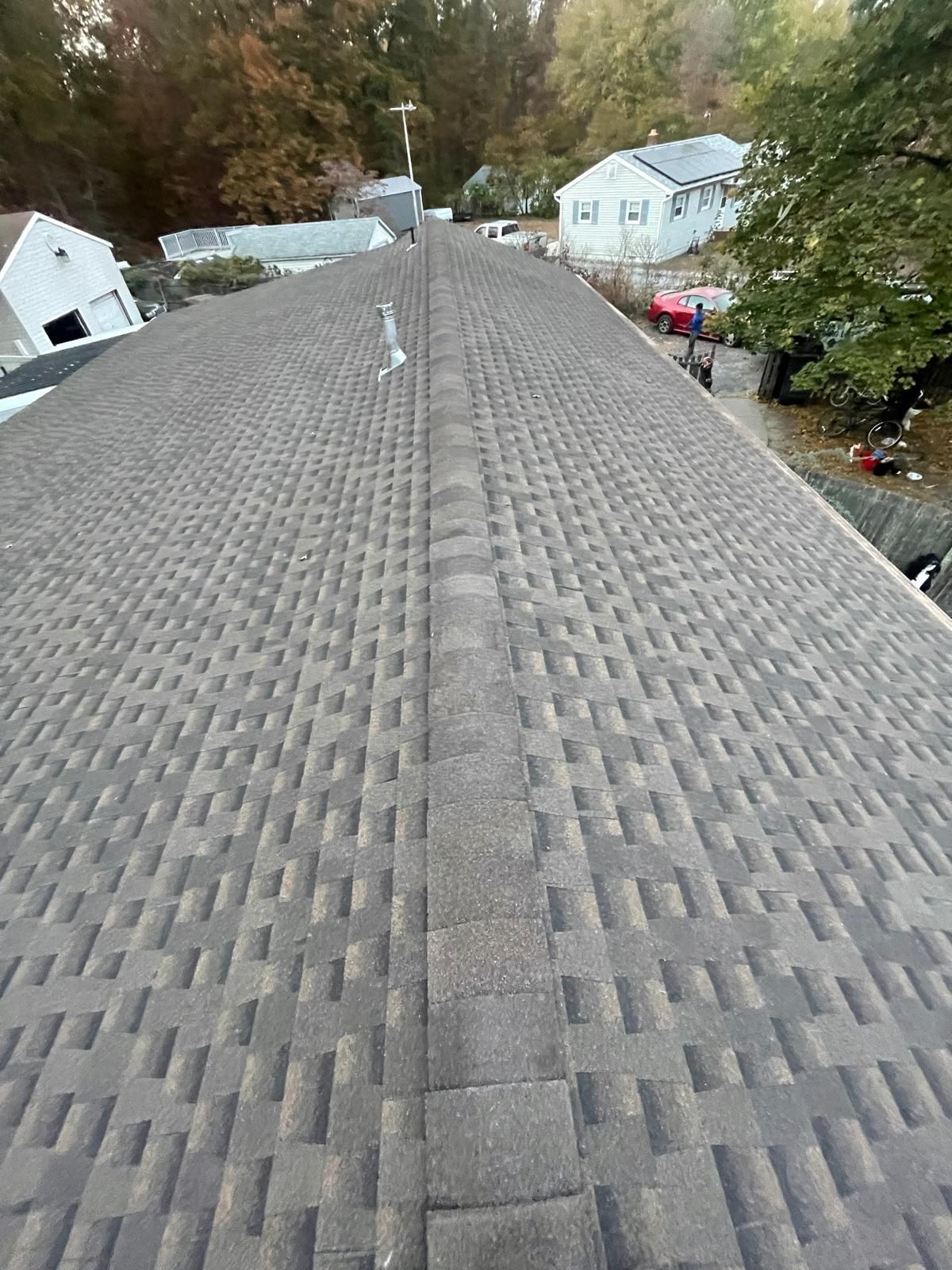 A close up of a roof with a lot of shingles on it.