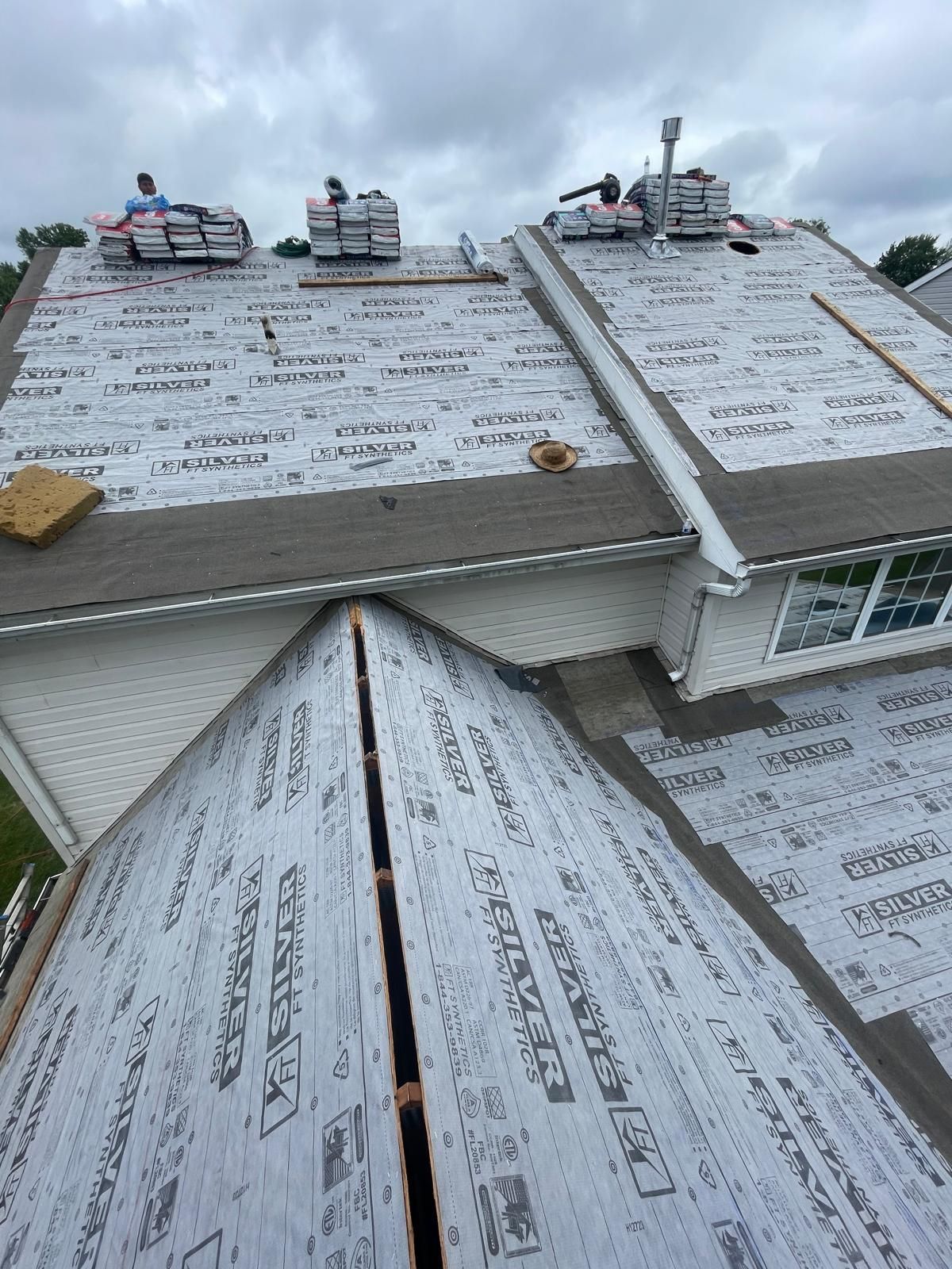A roof is being installed on a house.