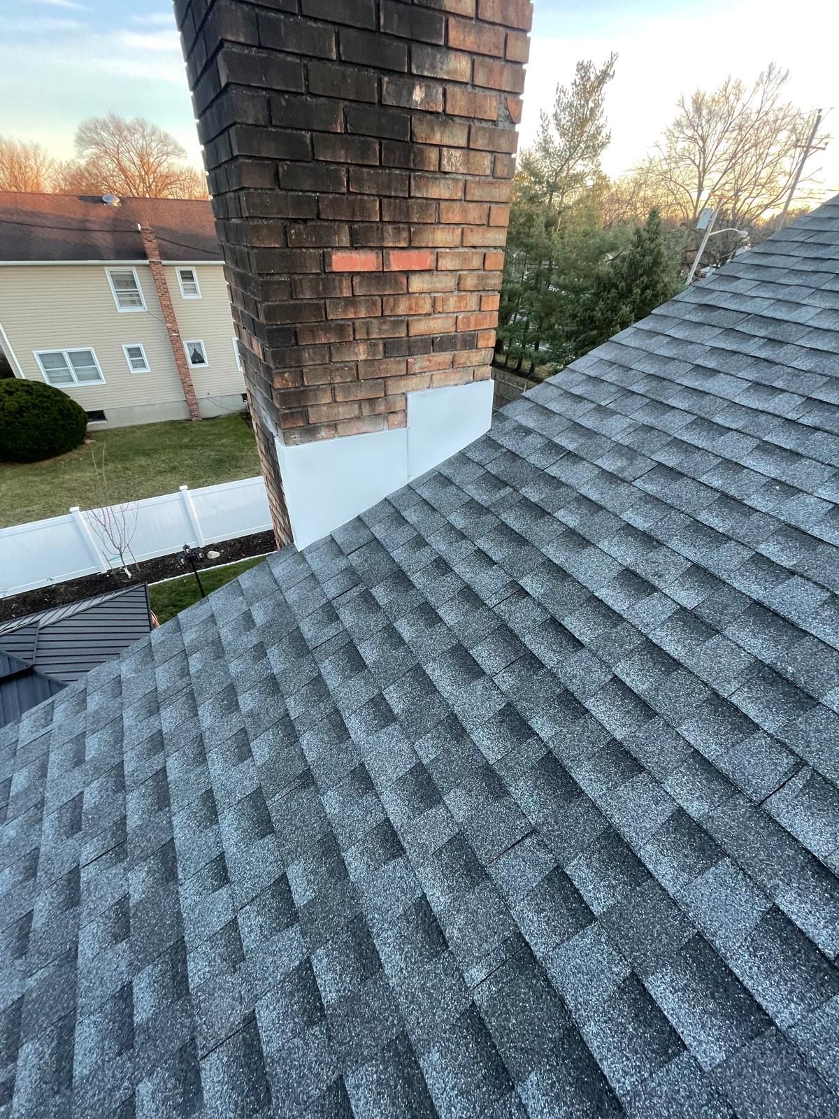 a roof with a brick chimney
