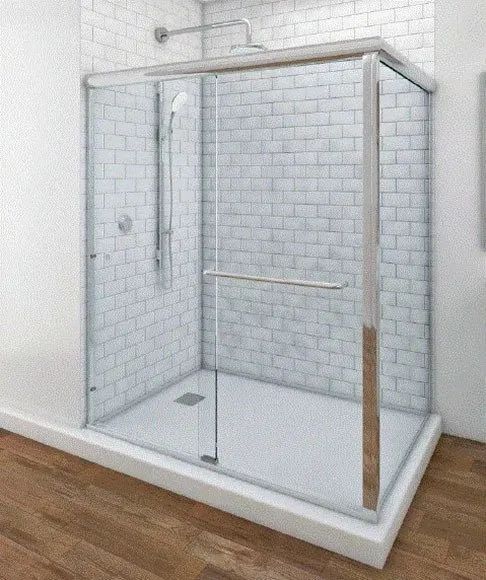A glass-enclosed shower stall with a white subway-tile back wall, chrome shower fixture, and a white shower tray.