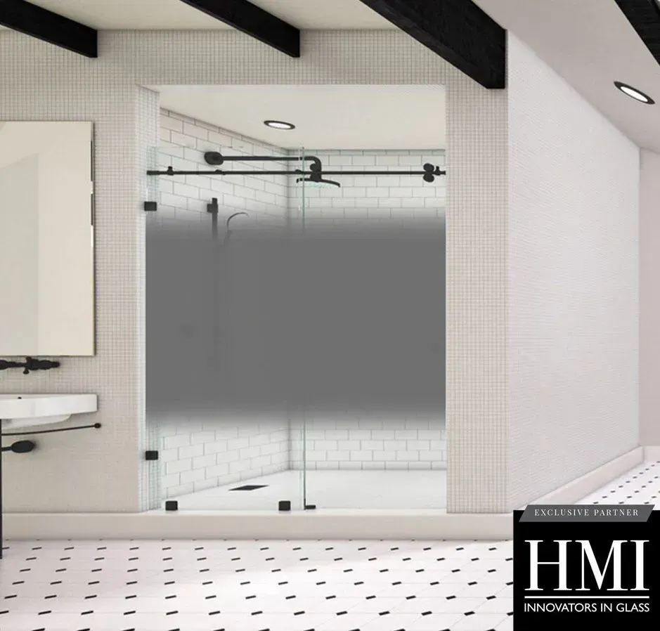 A walk-in shower with a black frame and hardware, featuring a frosted glass door in a white tiled bathroom.