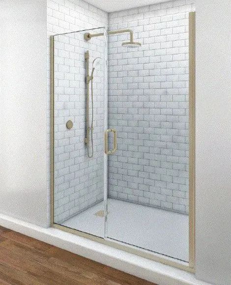 A glass shower door with gold hardware and a rain showerhead, set against white subway tile walls.