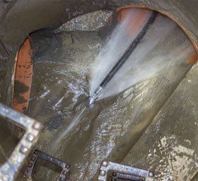 Water jet sewer cleaning