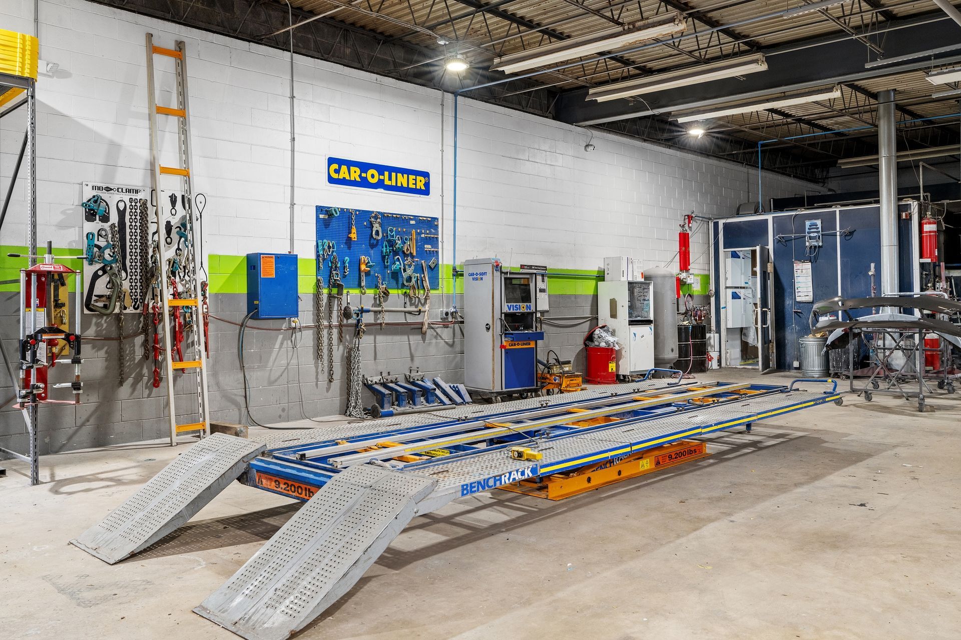 A car repair shop with a lot of tools and equipment