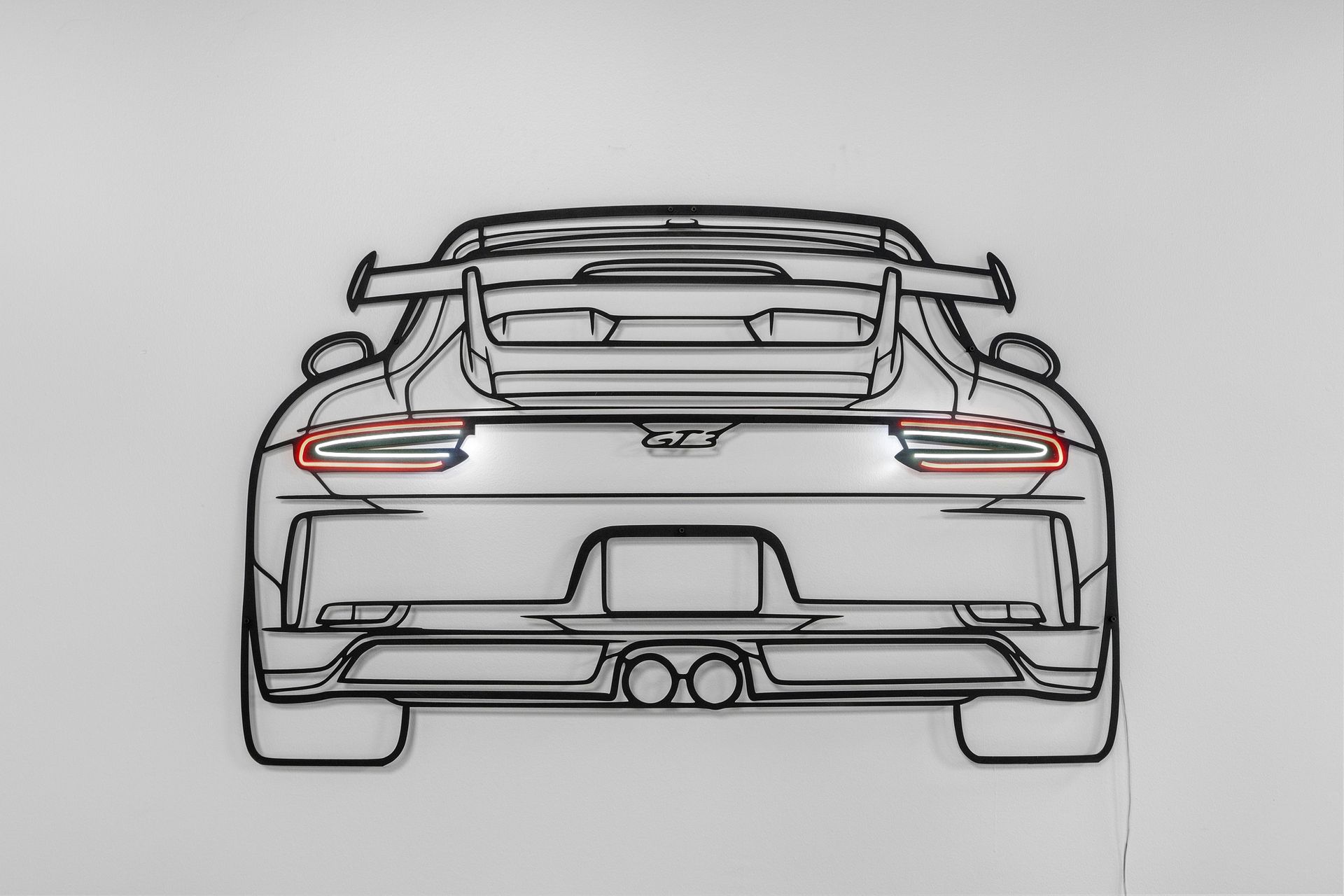 A black and white drawing of a sports car on a white background