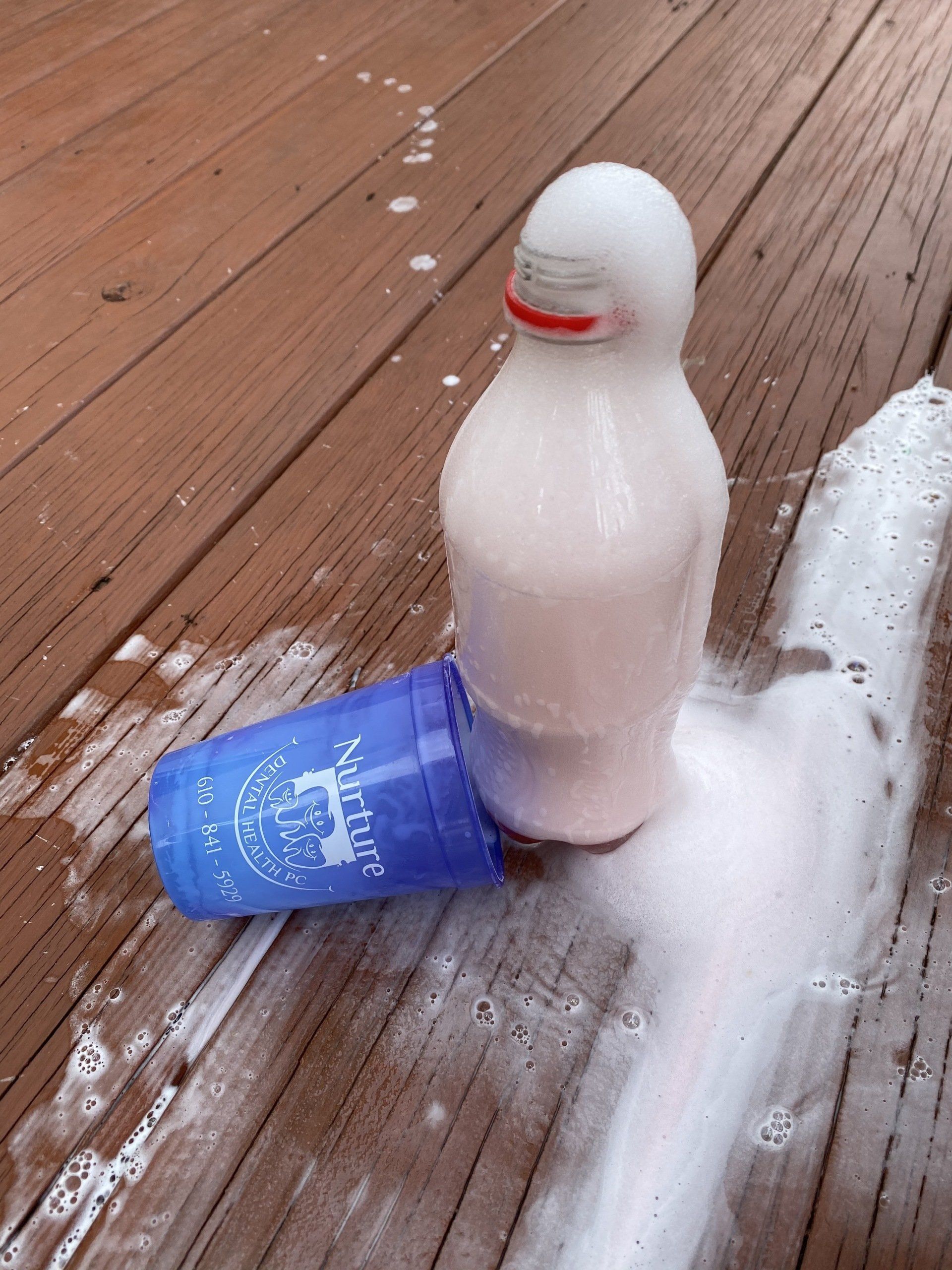 Soda bottle volcano using vinegar, baking soda and soap