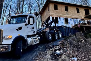 Ace Rolloff dumpster truck - residential construction