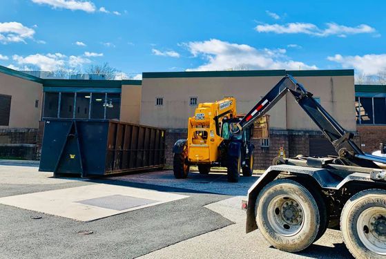 Ace Rolloff dumpster on commercial site